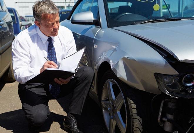 close-up of auto insurance certificate and car keys